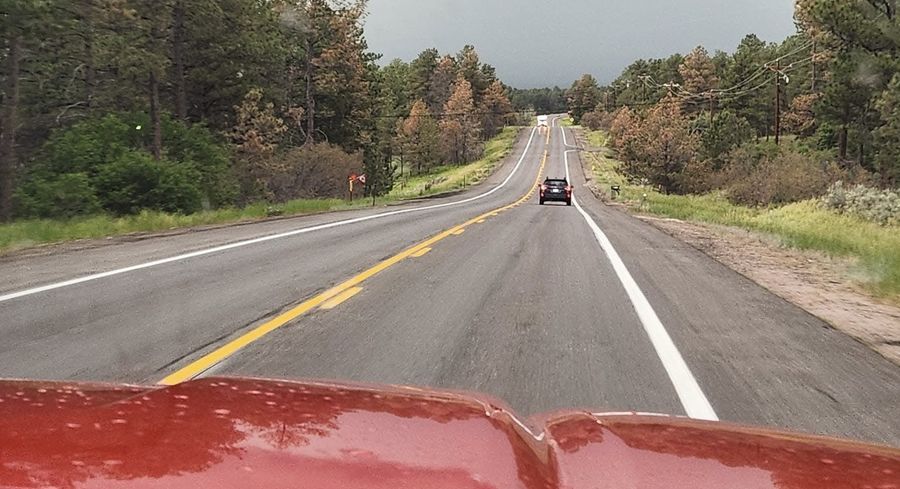 View from the Castlewood Canyon Equine field truck on a Colorado rural road
